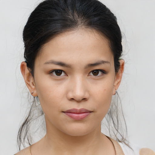 Joyful asian young-adult female with medium  brown hair and brown eyes