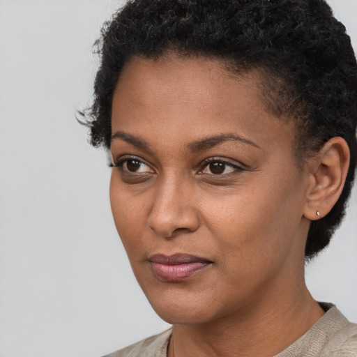 Neutral black young-adult female with short  black hair and brown eyes