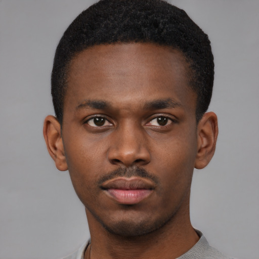 Neutral black young-adult male with short  brown hair and brown eyes