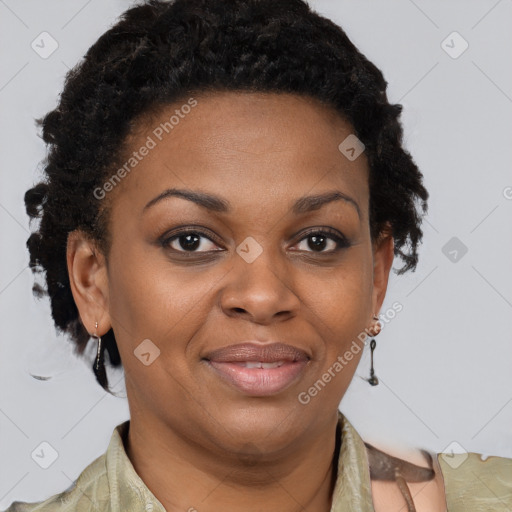 Joyful black adult female with short  brown hair and brown eyes