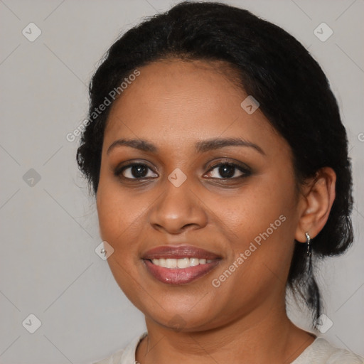 Joyful black young-adult female with medium  black hair and brown eyes