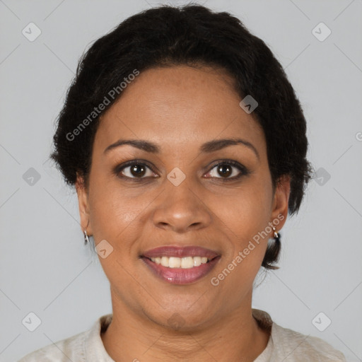 Joyful black adult female with short  brown hair and brown eyes