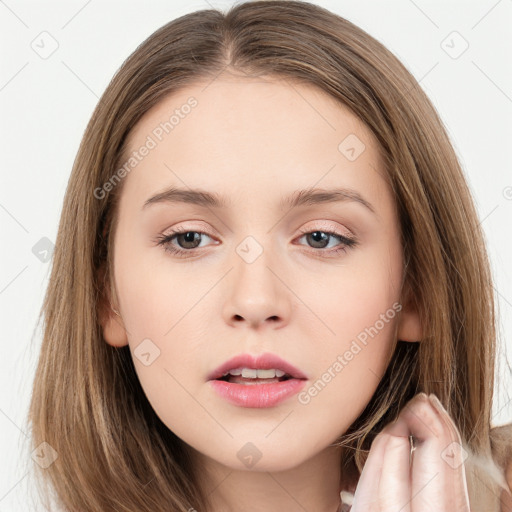 Neutral white young-adult female with long  brown hair and brown eyes