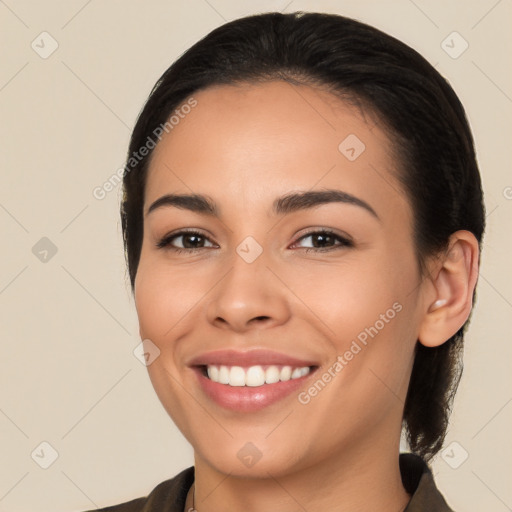 Joyful white young-adult female with long  brown hair and brown eyes