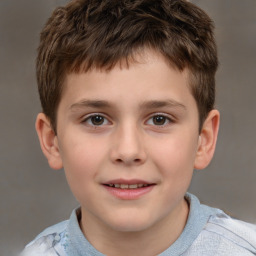 Joyful white child male with short  brown hair and brown eyes