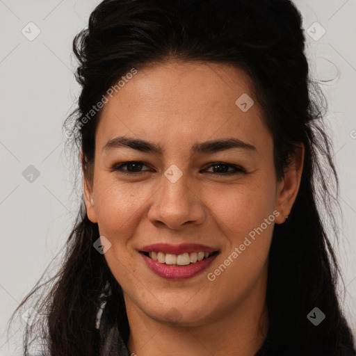 Joyful latino young-adult female with long  brown hair and brown eyes