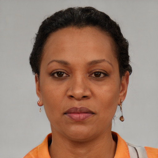 Neutral black adult female with short  brown hair and brown eyes