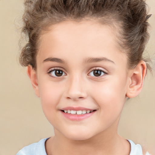 Joyful white child female with short  brown hair and brown eyes