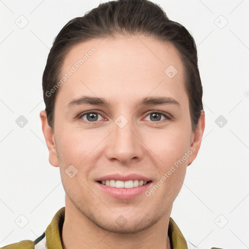 Joyful white young-adult male with short  brown hair and brown eyes