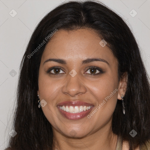 Joyful black young-adult female with long  brown hair and brown eyes