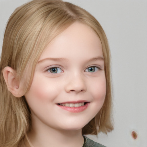 Joyful white child female with long  brown hair and blue eyes