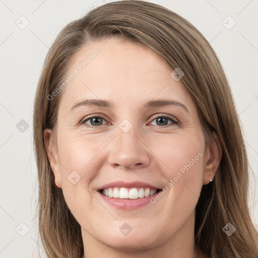 Joyful white young-adult female with long  brown hair and grey eyes