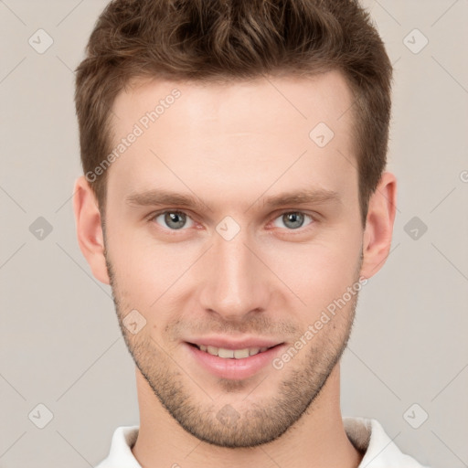 Joyful white young-adult male with short  brown hair and grey eyes