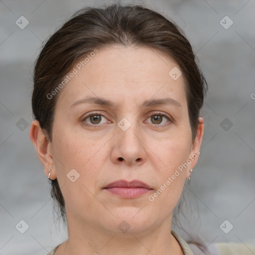 Joyful white adult female with medium  brown hair and grey eyes