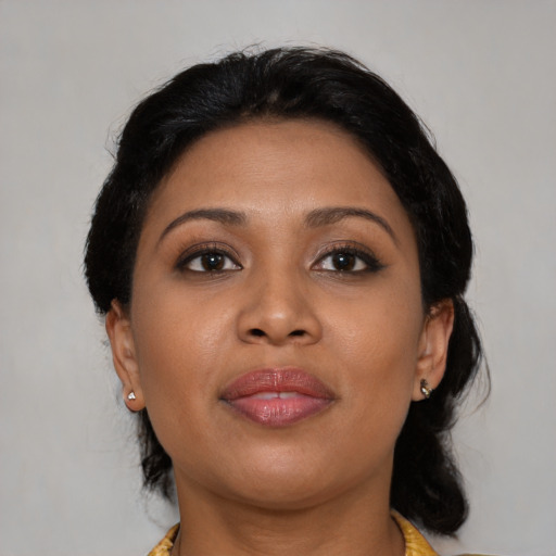 Joyful asian young-adult female with medium  brown hair and brown eyes