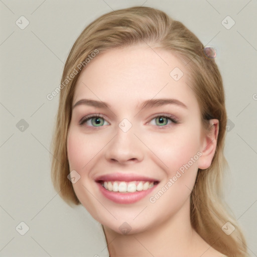 Joyful white young-adult female with long  brown hair and green eyes