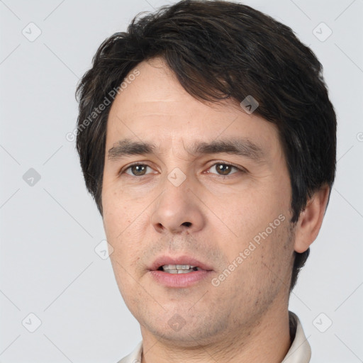 Neutral white adult male with short  black hair and brown eyes