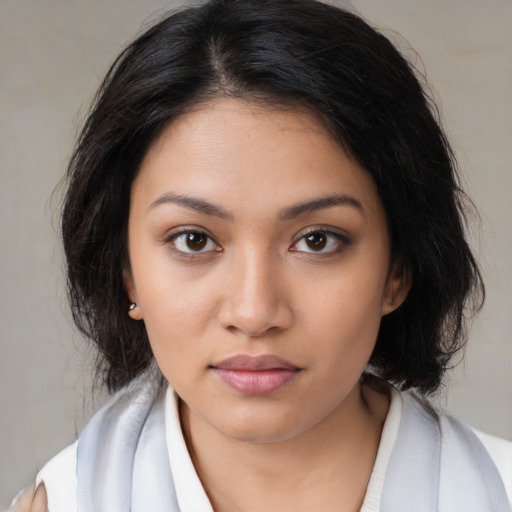 Neutral latino young-adult female with medium  brown hair and brown eyes
