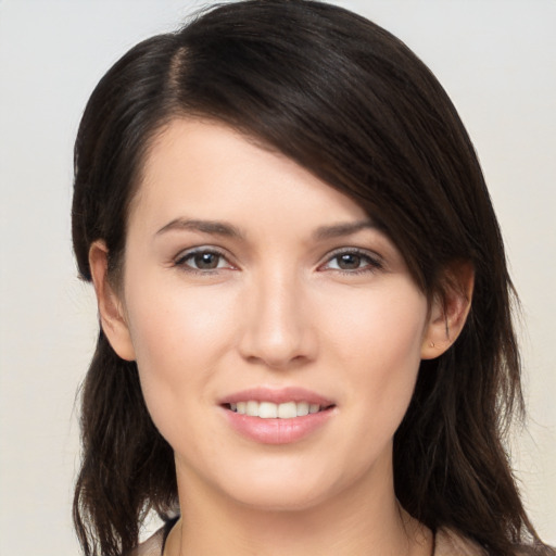 Joyful white young-adult female with medium  brown hair and brown eyes