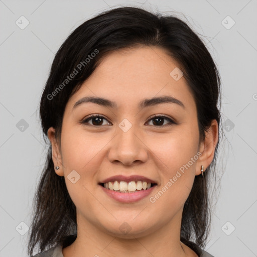 Joyful latino young-adult female with medium  brown hair and brown eyes