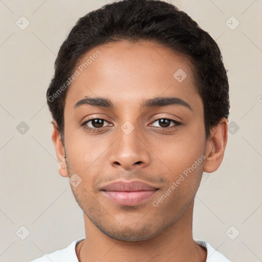 Joyful latino young-adult male with short  brown hair and brown eyes