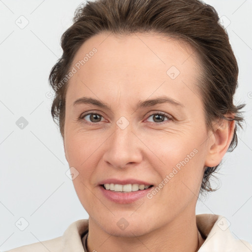 Joyful white adult female with short  brown hair and brown eyes