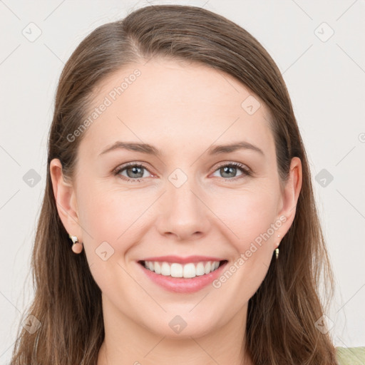 Joyful white young-adult female with long  brown hair and grey eyes