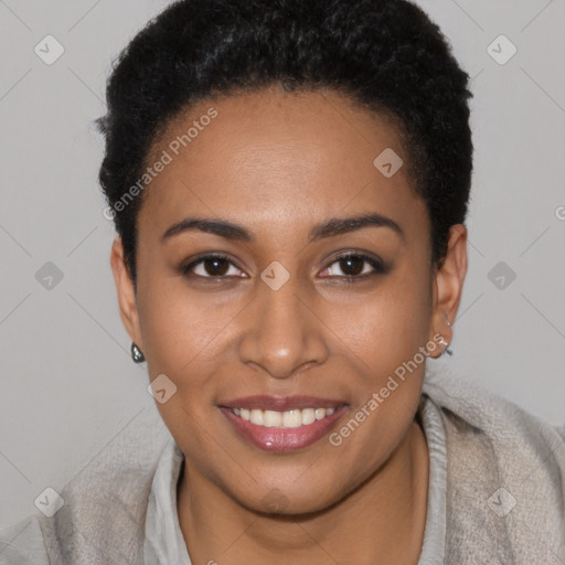 Joyful black young-adult female with short  brown hair and brown eyes