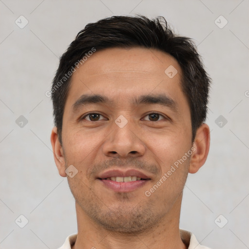 Joyful asian young-adult male with short  black hair and brown eyes