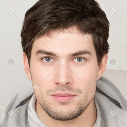 Neutral white young-adult male with short  brown hair and brown eyes