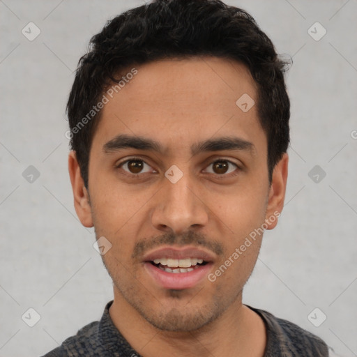 Joyful latino young-adult male with short  black hair and brown eyes