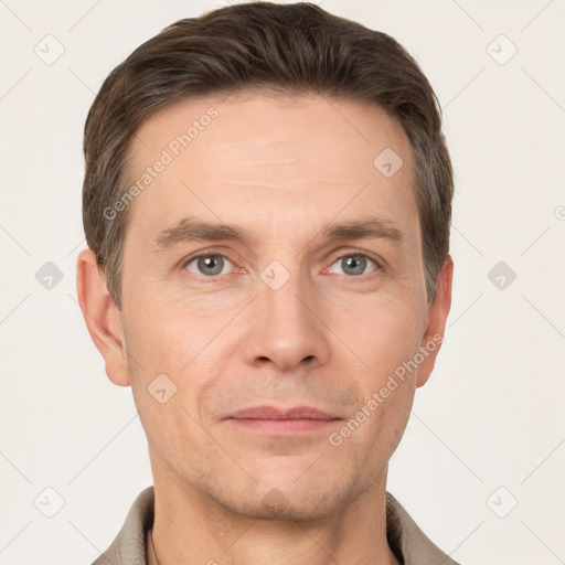 Joyful white adult male with short  brown hair and grey eyes