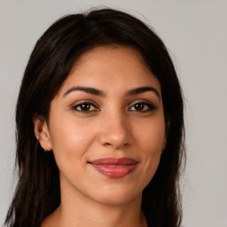 Joyful white young-adult female with long  brown hair and brown eyes