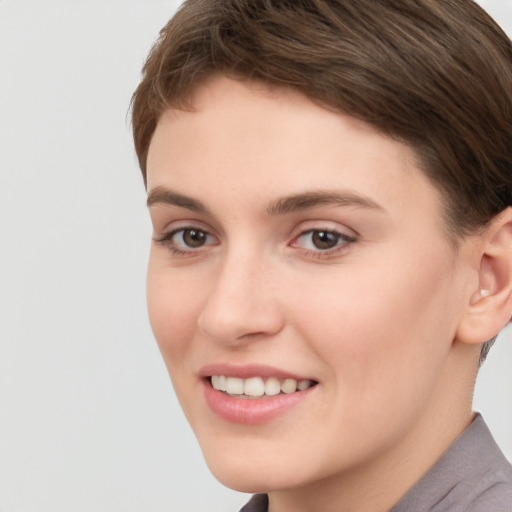 Joyful white young-adult female with short  brown hair and brown eyes