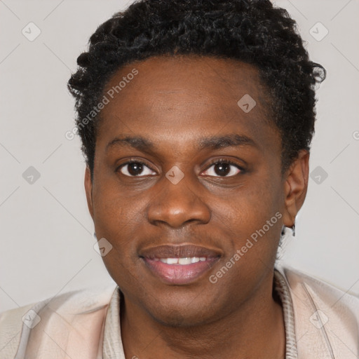 Joyful black young-adult male with short  brown hair and brown eyes