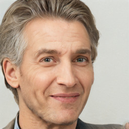 Joyful white adult male with short  brown hair and grey eyes