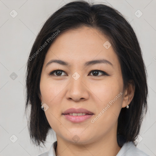 Joyful asian young-adult female with medium  brown hair and brown eyes