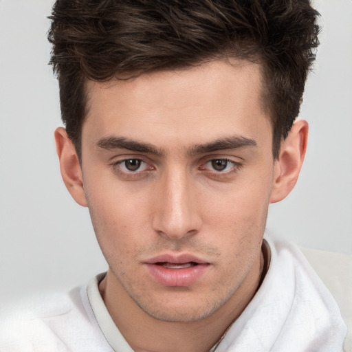 Neutral white young-adult male with short  brown hair and brown eyes