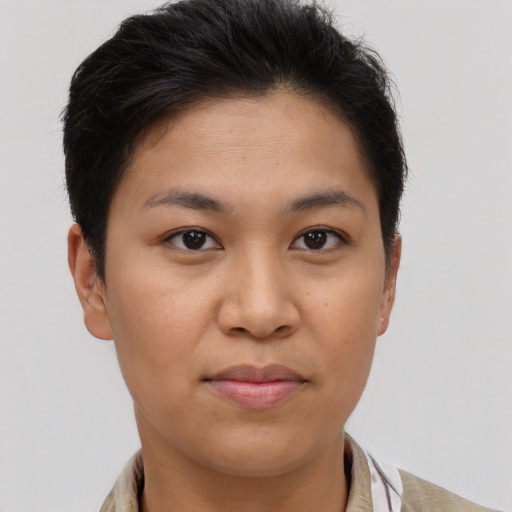 Joyful latino young-adult female with short  brown hair and brown eyes