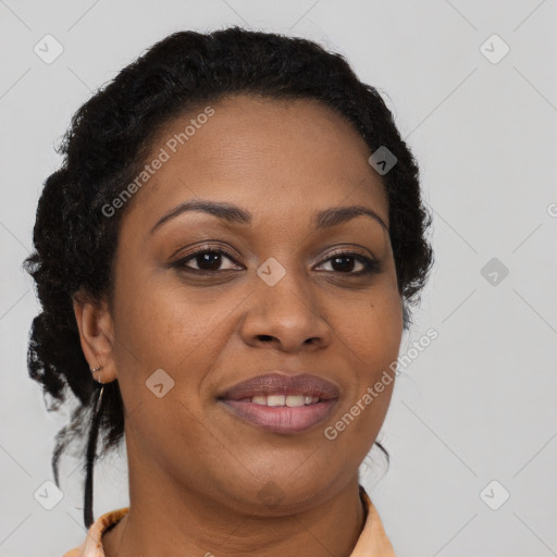 Joyful black young-adult female with long  brown hair and brown eyes