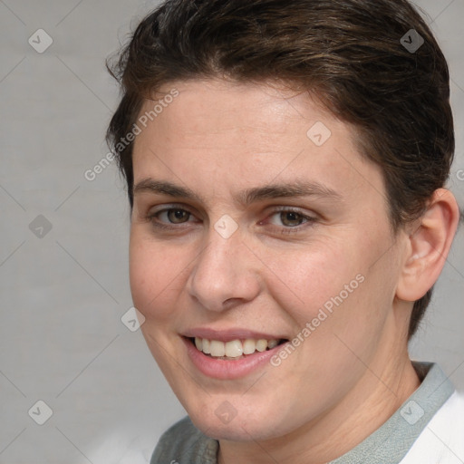 Joyful white adult female with short  brown hair and brown eyes