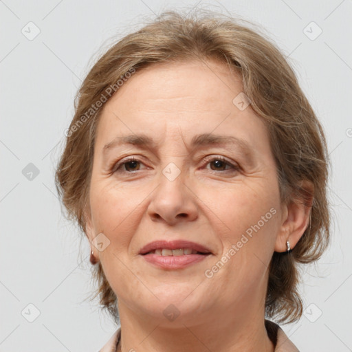 Joyful white adult female with medium  brown hair and brown eyes