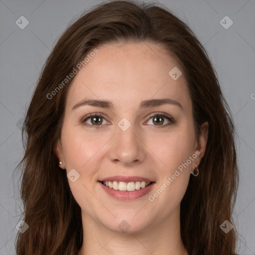 Joyful white young-adult female with long  brown hair and green eyes