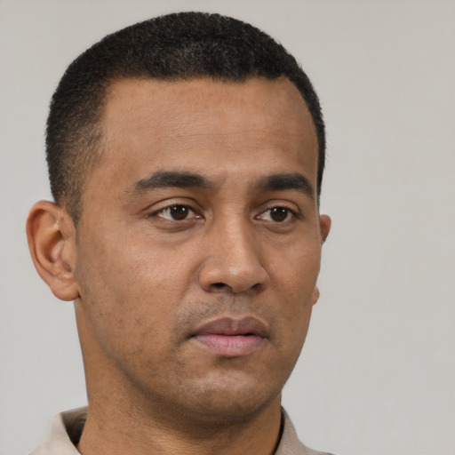 Neutral latino young-adult male with short  brown hair and brown eyes