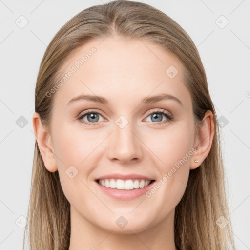 Joyful white young-adult female with long  brown hair and blue eyes