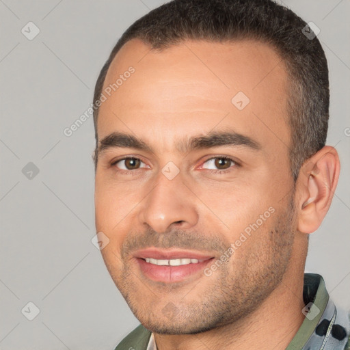 Joyful white young-adult male with short  brown hair and brown eyes