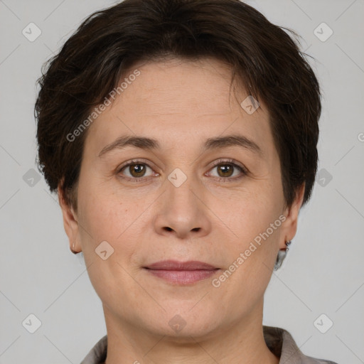 Joyful white adult female with short  brown hair and brown eyes