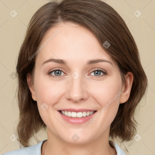 Joyful white young-adult female with medium  brown hair and green eyes