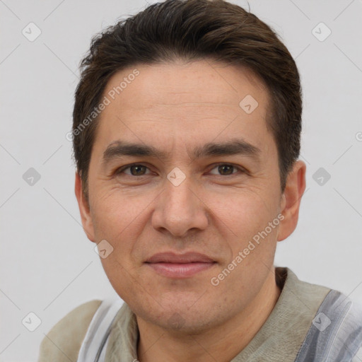 Joyful white adult male with short  brown hair and brown eyes