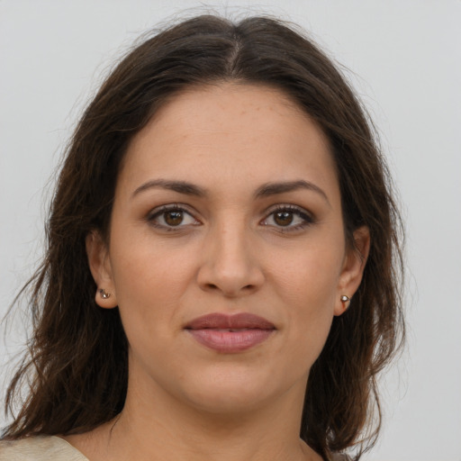 Joyful white young-adult female with medium  brown hair and brown eyes